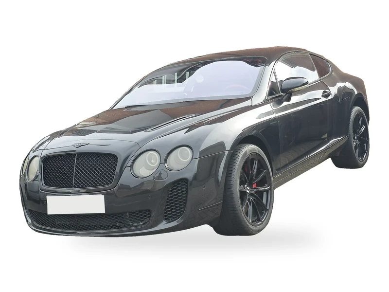 Dunkelgrauer Bentley Continental GT von 2004 auf weißem Hintergrund